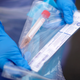 A NHS nurse holds a Coronavirus testing kit as she speaks to the media at a drive through Coronavirus testing site in a car park on March 12, 2020 in Wolverhampton, England.